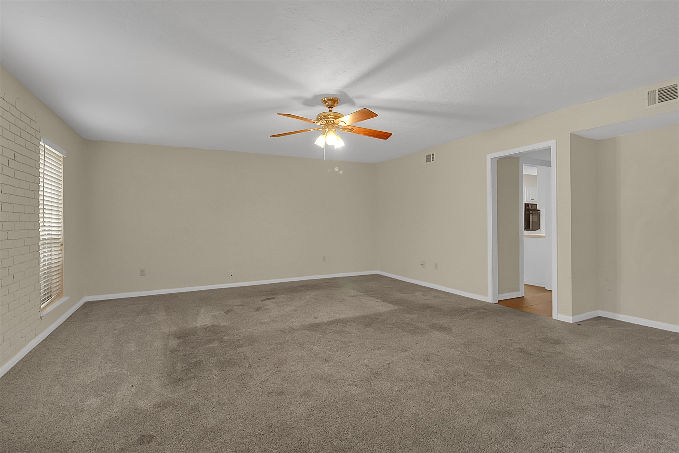 1304 Ward Road, Unit 5 Baytown, TX 77520 - Photo 2 of 19 a view of an empty room with a window