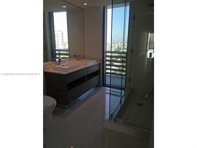 460 Northeast 28th Street, Unit 2001 Miami, FL 33137 - Photo 11 of 28 a bathroom with a sink and a mirror