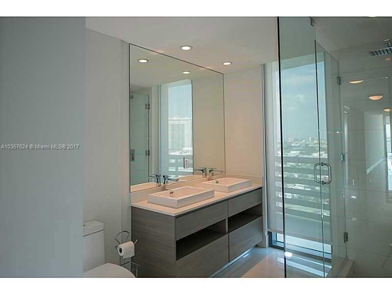 460 Northeast 28th Street, Unit 2001 Miami, FL 33137 - Photo 12 of 28 a bathroom with a sink and a mirror