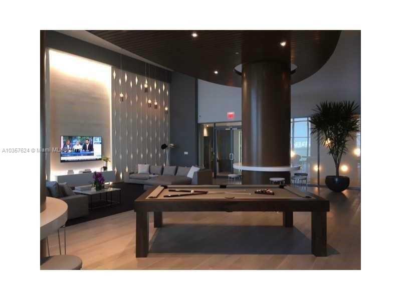 460 Northeast 28th Street, Unit 2001 Miami, FL 33137 - Photo 15 of 28 a living room with furniture and a large window