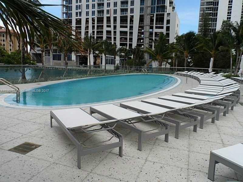 460 Northeast 28th Street, Unit 2001 Miami, FL 33137 - Photo 19 of 28 a view of a patio with a table and chairs