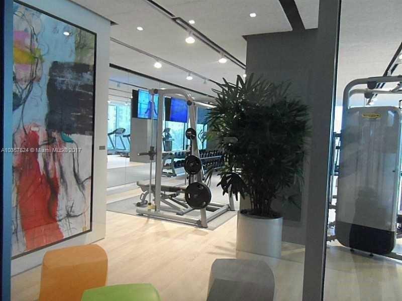 460 Northeast 28th Street, Unit 2001 Miami, FL 33137 - Photo 20 of 28 a view of a room with gym equipment