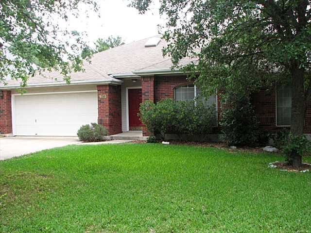 6024 Roxbury Lane Austin, TX 78739 - Photo 1 of 1 a front view of a house with garden