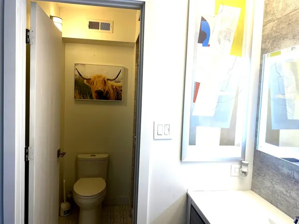 a bathroom with a toilet and a sink
