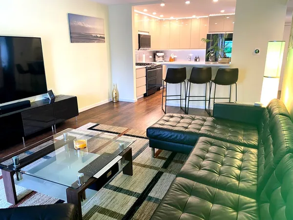 a living room with a couch and a flat screen tv