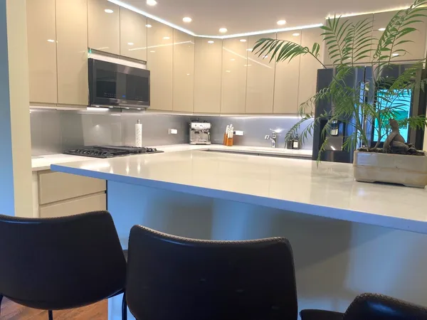 a kitchen with a sink and a refrigerator