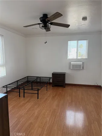 a room with furniture and a wooden floor