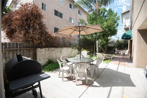 a view of patio with furniture