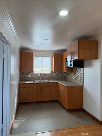 a kitchen with stainless steel appliances granite countertop a stove and a refrigerator