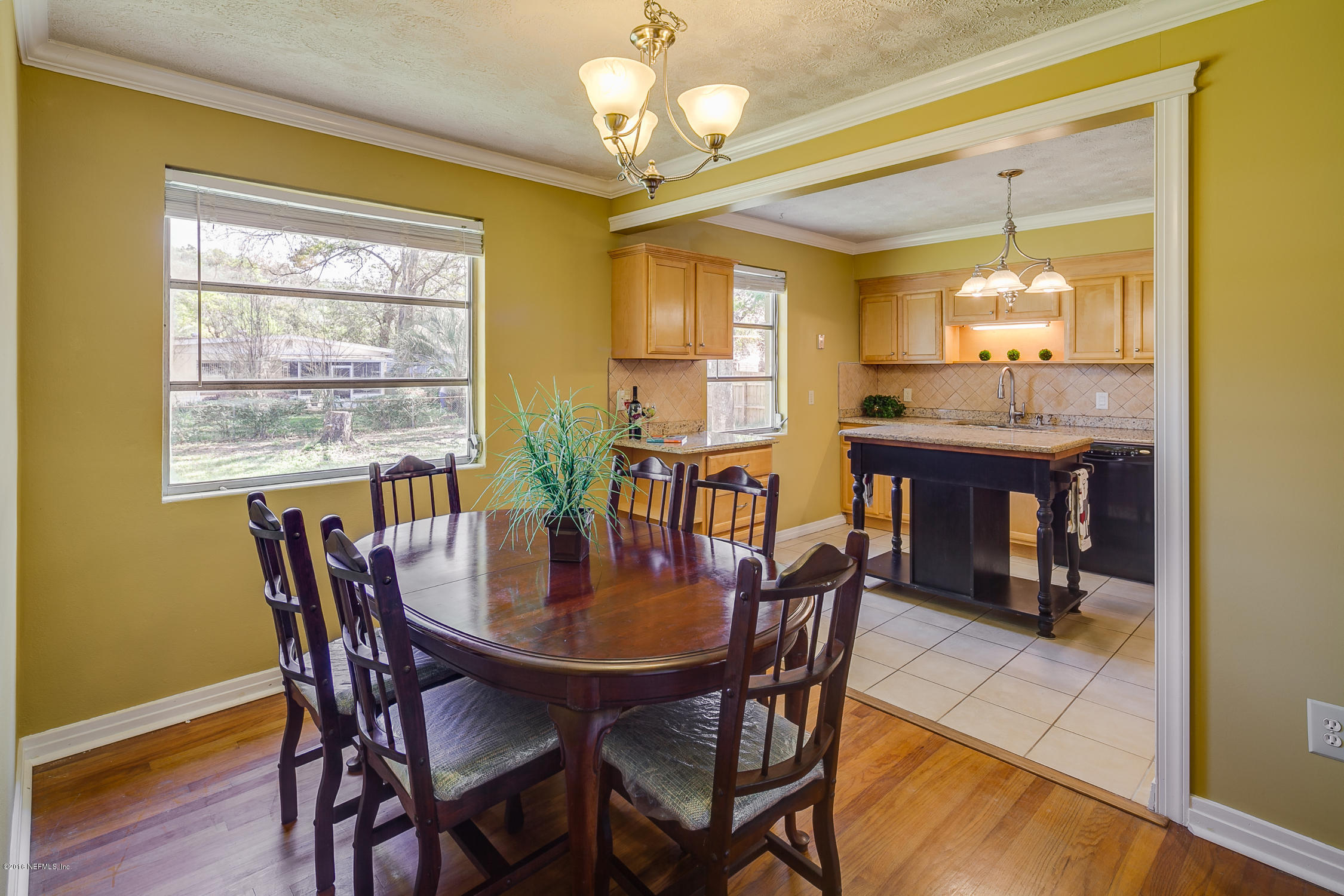 5451 Cardan Road Jacksonville, FL 32244 - Photo 6 of 26 a view of a dining room with furniture window and wooden floor