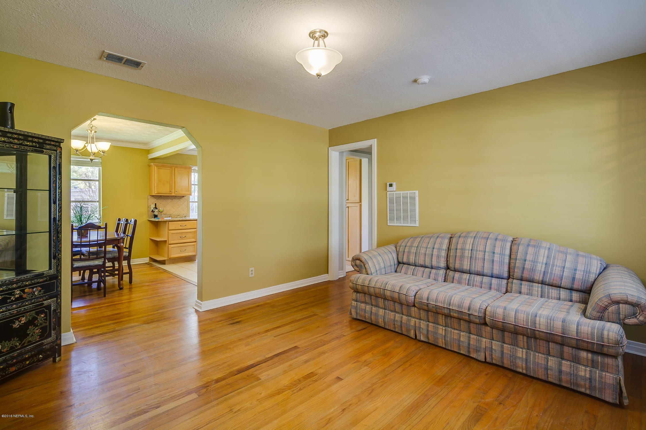 5451 Cardan Road Jacksonville, FL 32244 - Photo 8 of 26 a living room with furniture and a flat screen tv