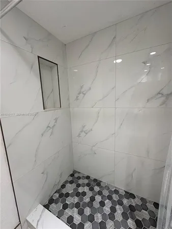 a bathroom with a sink and a shower