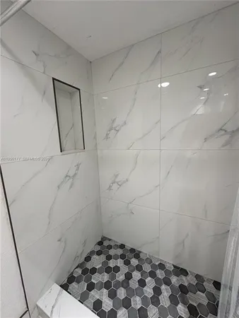 a bathroom with a sink and a shower