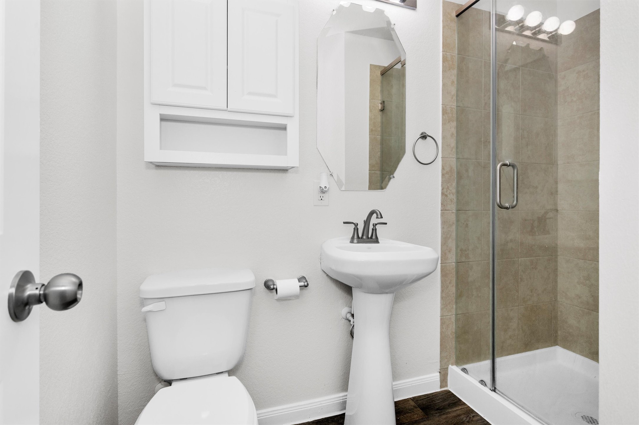 15134 Austin Road Willis, TX 77378 - Photo 14 of 20 a bathroom with a sink toilet and shower