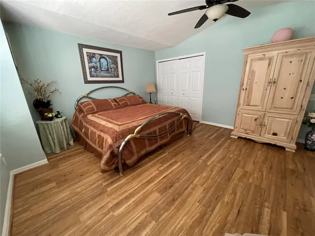 a bedroom with a bed and dresser