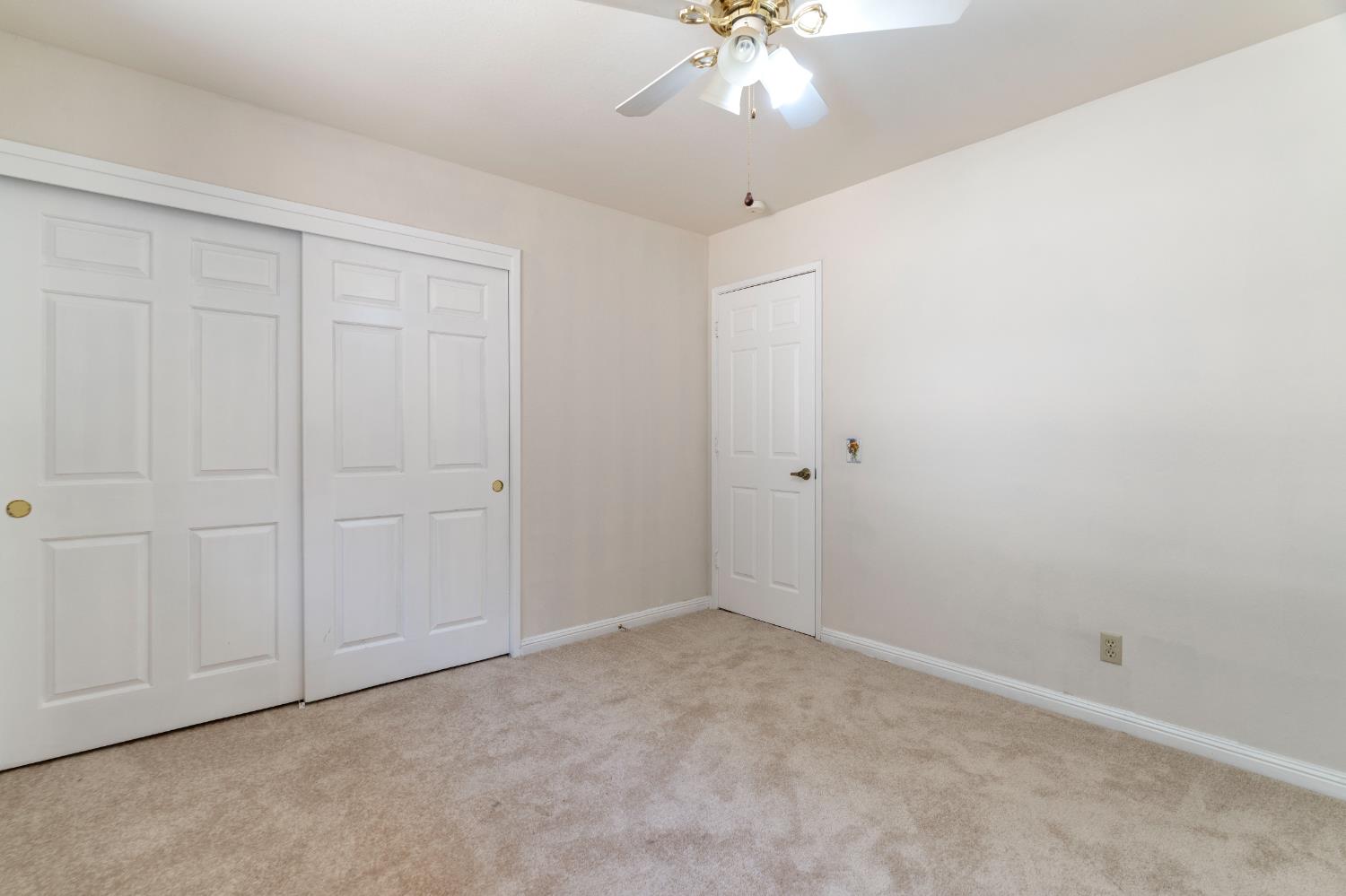 3830 Wilson Loop Placerville, CA 95667 - Photo 12 of 36 an empty room with a chandelier fan