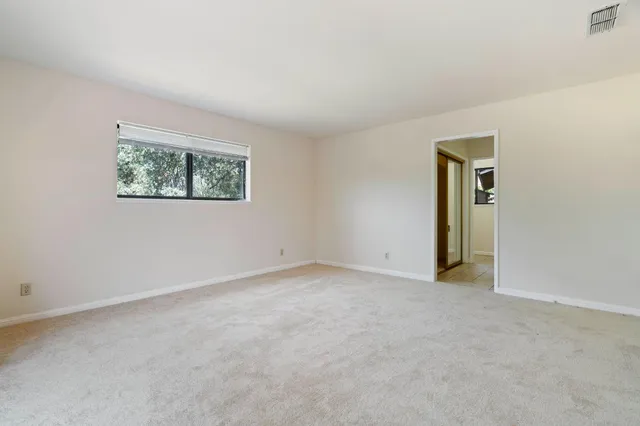 an empty room with a hallway