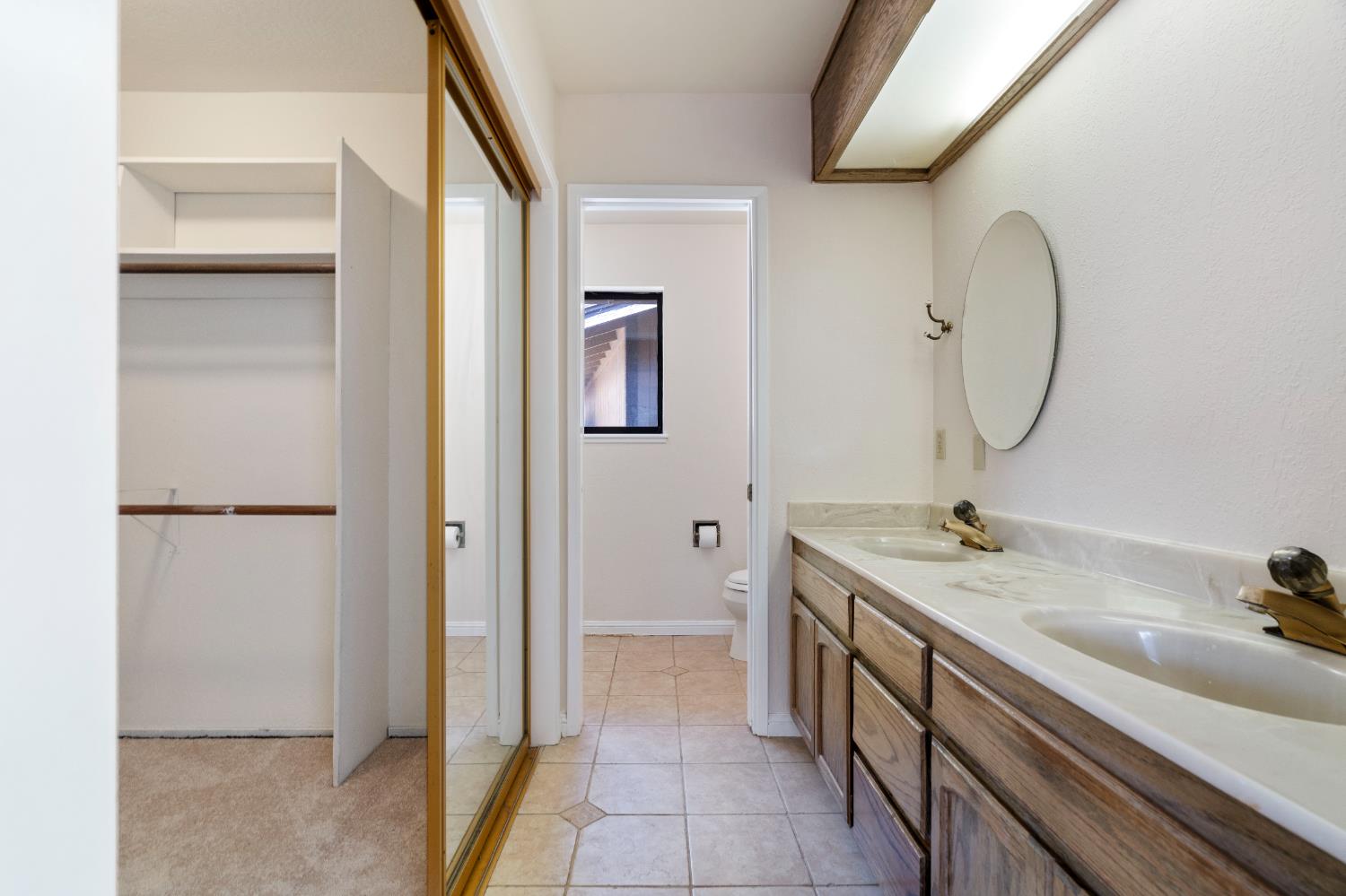 3830 Wilson Loop Placerville, CA 95667 - Photo 17 of 36 a spacious bathroom with a double vanity sink and a mirror