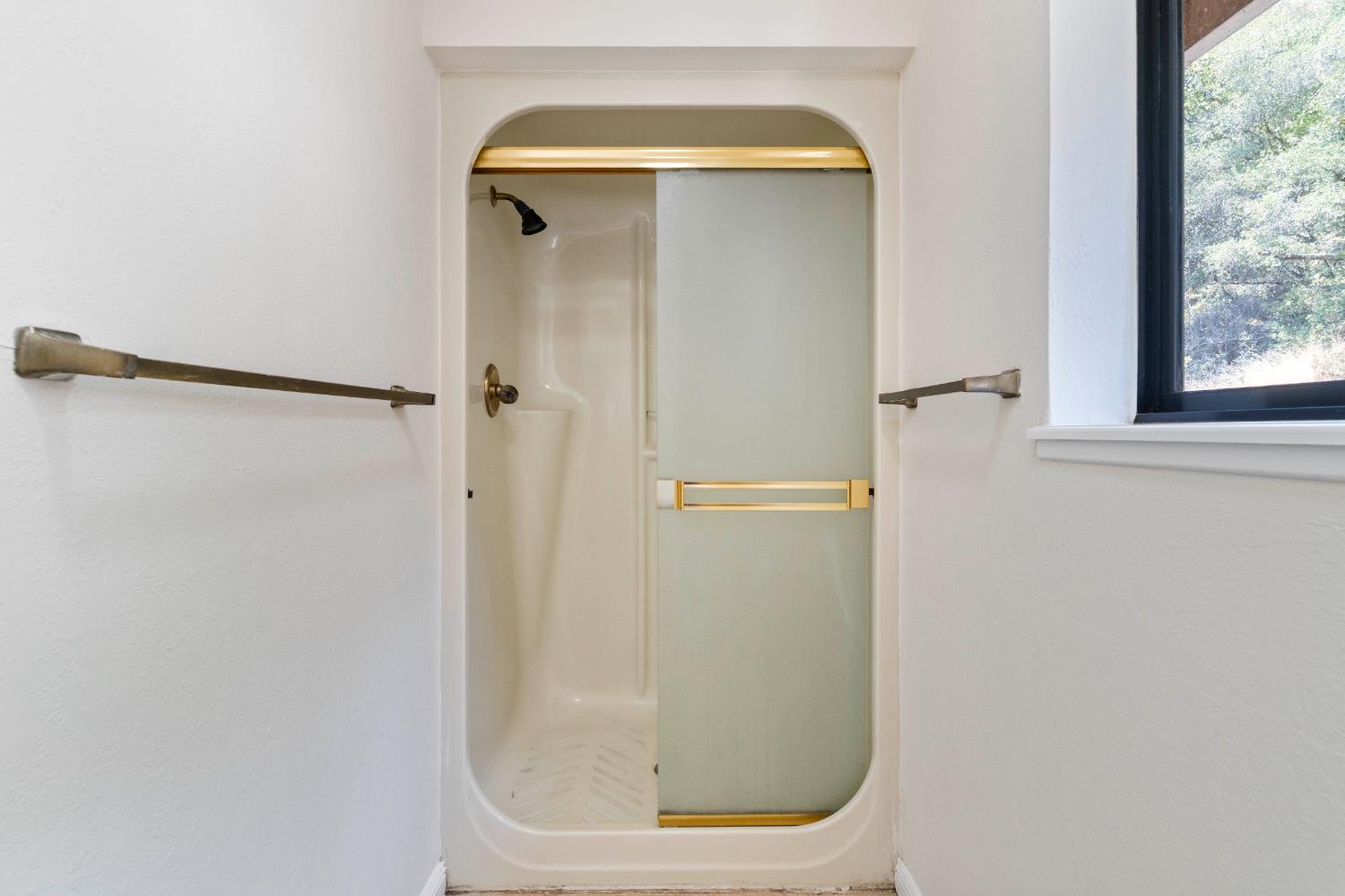 3830 Wilson Loop Placerville, CA 95667 - Photo 19 of 36 a bathroom with a glass shower door