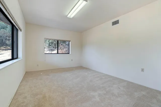 an empty room with windows