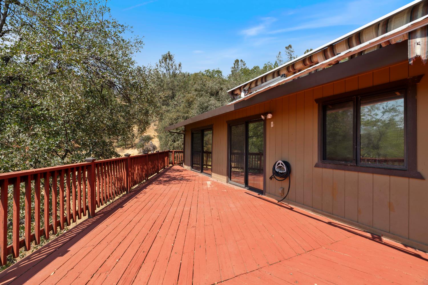 3830 Wilson Loop Placerville, CA 95667 - Photo 26 of 36 a balcony with wooden floor and outdoor seating