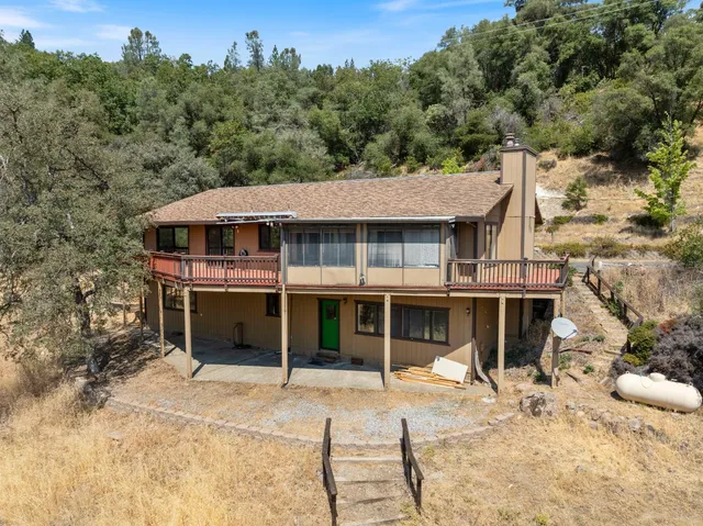 a house with trees in the background
