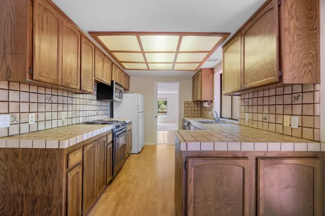 a kitchen with a stove and cabinets