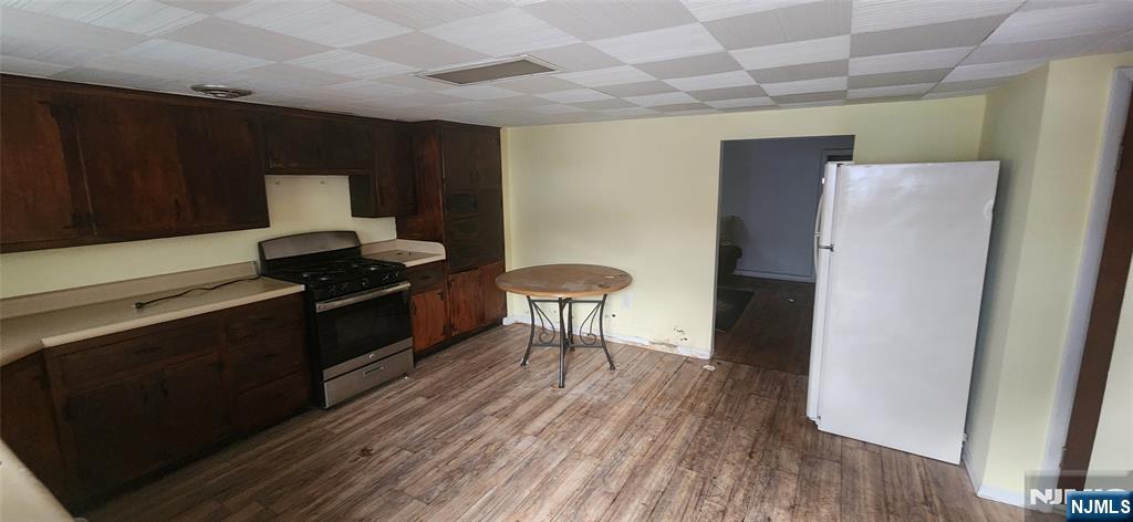 230 New Street Lyndhurst, NJ 07071 - Photo 9 of 10 a kitchen with a refrigerator and a stove top oven