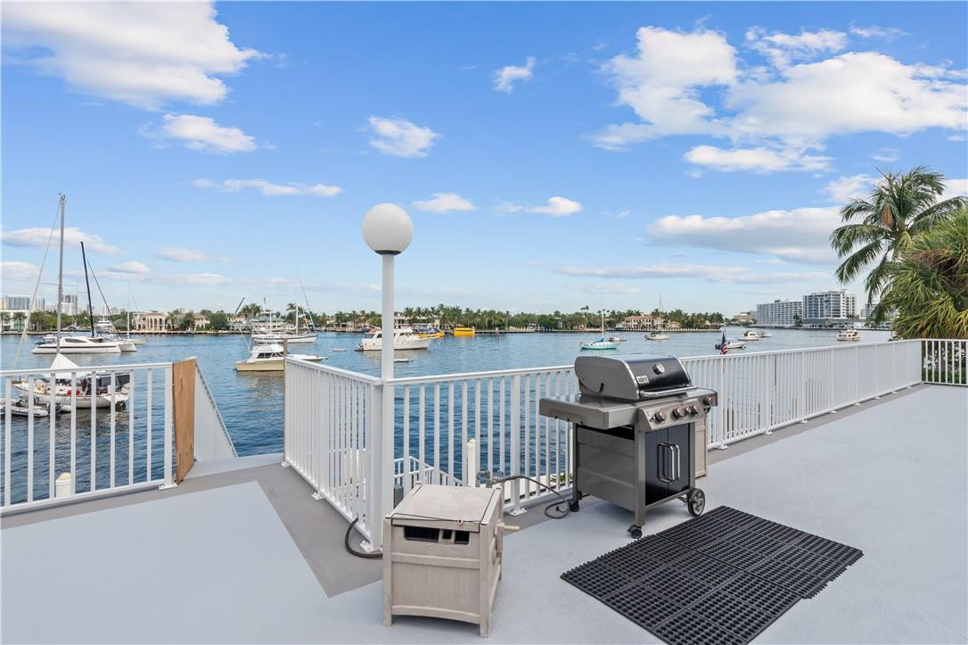 95 North Birch Road, Unit 405 Fort Lauderdale, FL 33304 - Photo 8 of 34 a view of roof deck with table and chairs