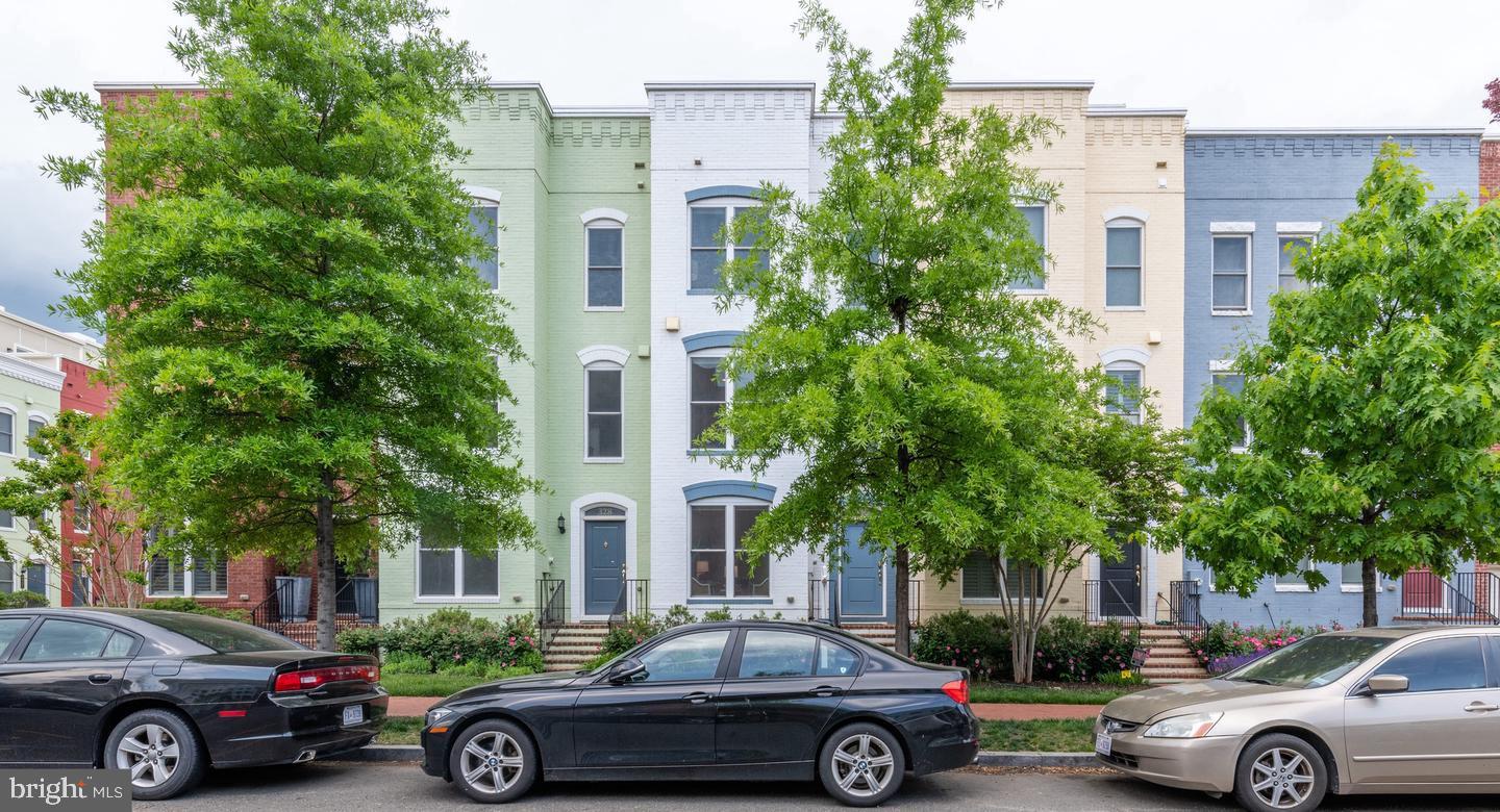 a view of a cars parked in front of a house