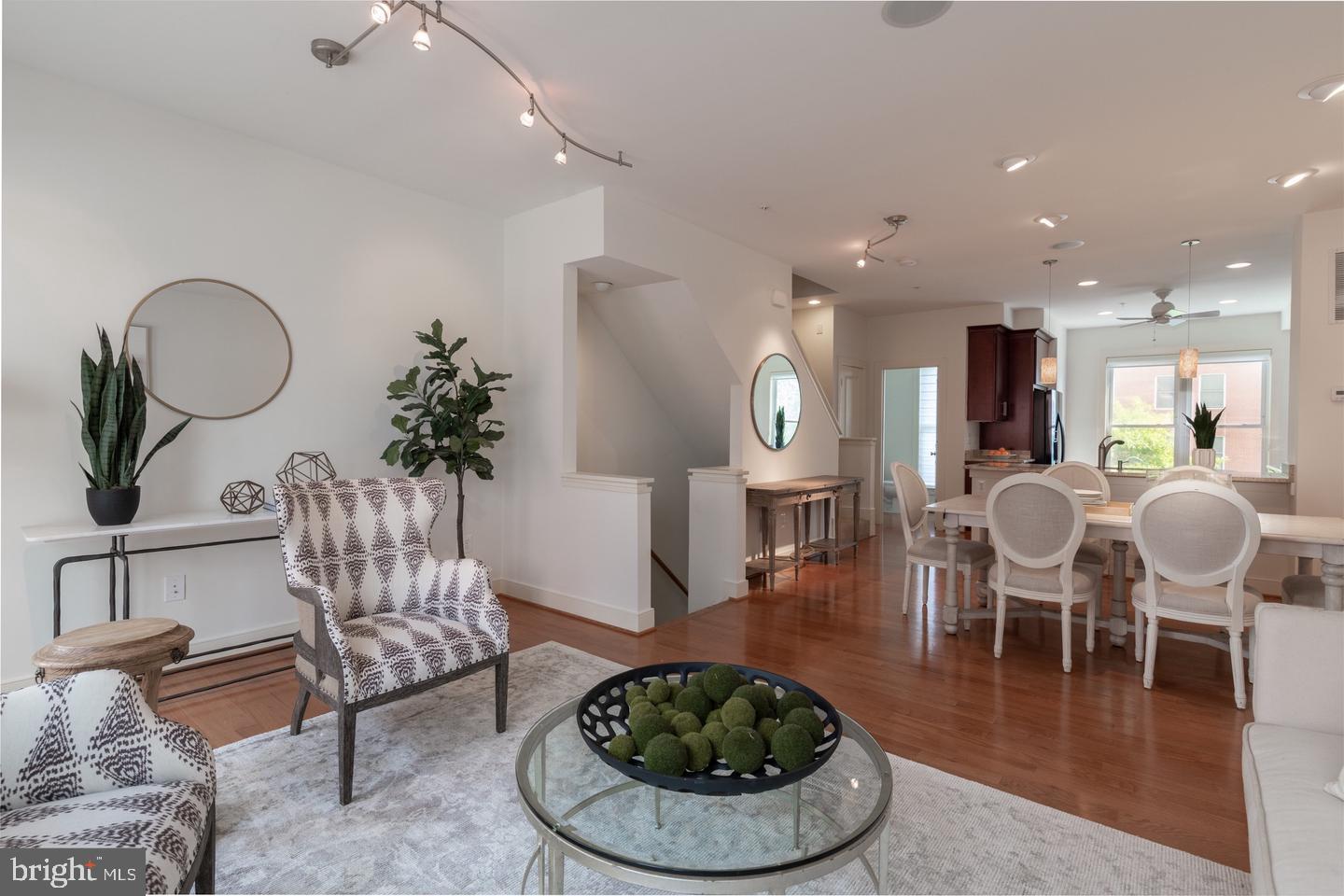 330 L Street Southeast Washington, DC 20003 - Photo 6 of 17 a living room with furniture a dining table and glass windows