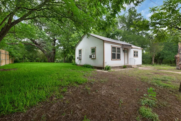 a house with a tree in front of it