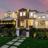 a front view of house and yard with green space