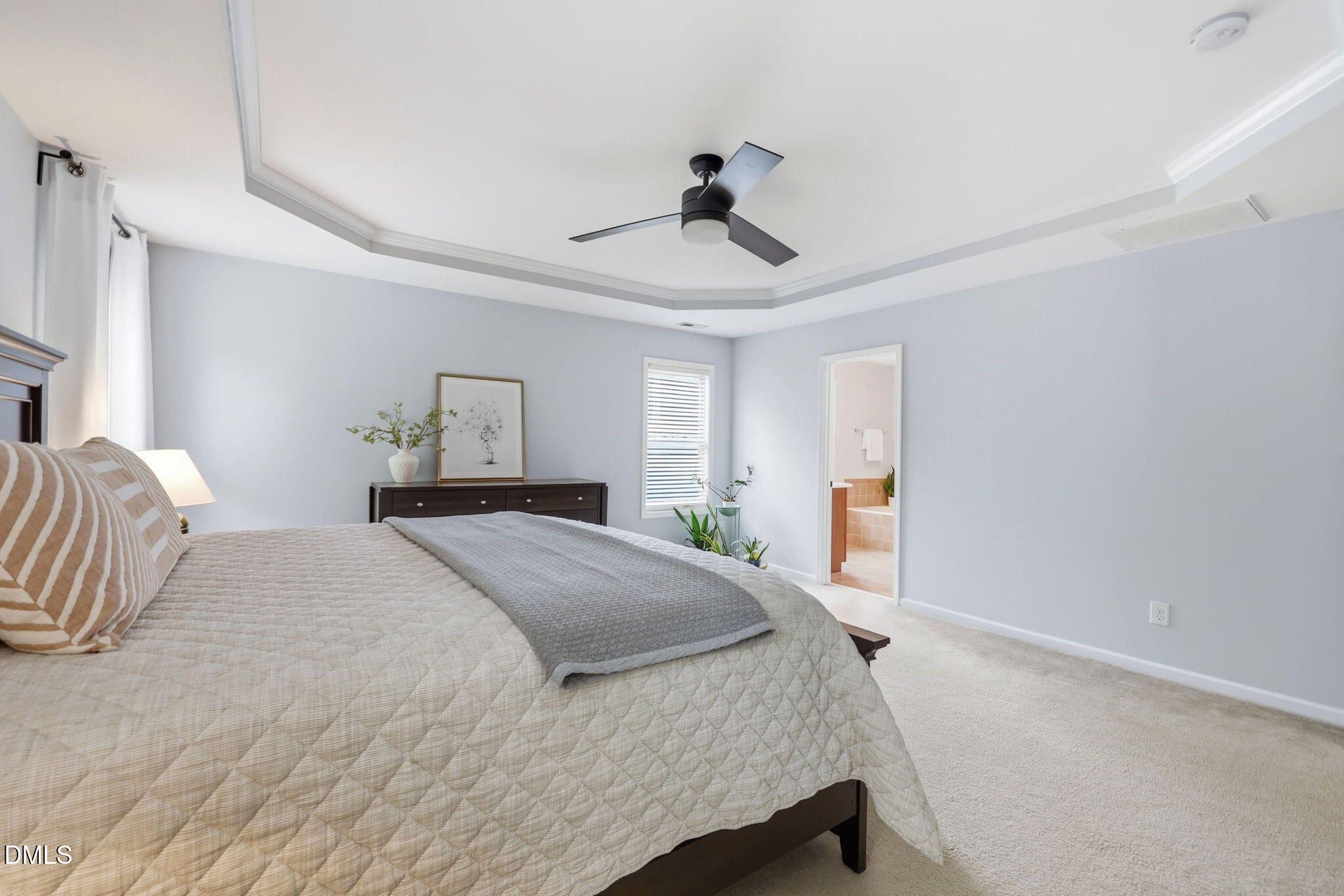 162 Gathering Place Durham, NC 27713 - Photo 23 of 52 a bedroom with a bed and a chandelier