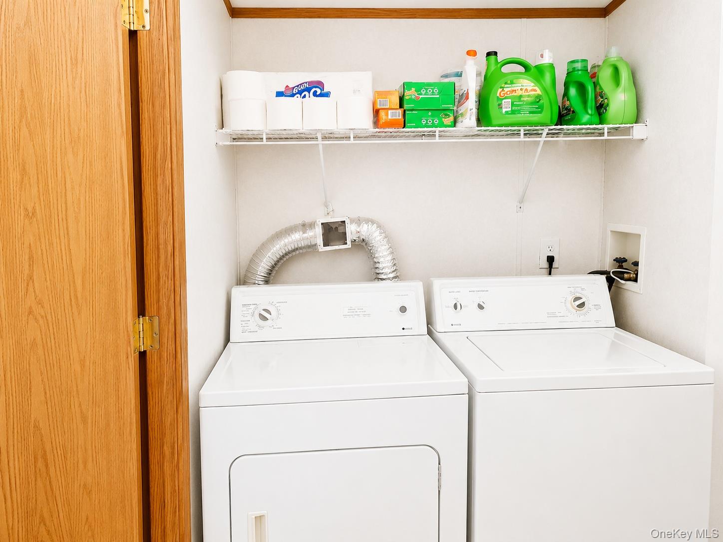 182-184 Mutton Hill Road Neversink, NY 12765 - Photo 30 of 36 Dedicated laundry area featuring a white clothes dryer, a white washing machine, and a white wire shelf for storage