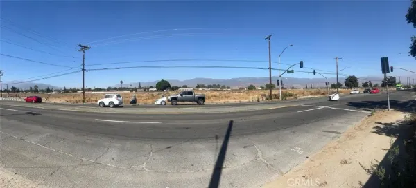 a view of a city street with cars