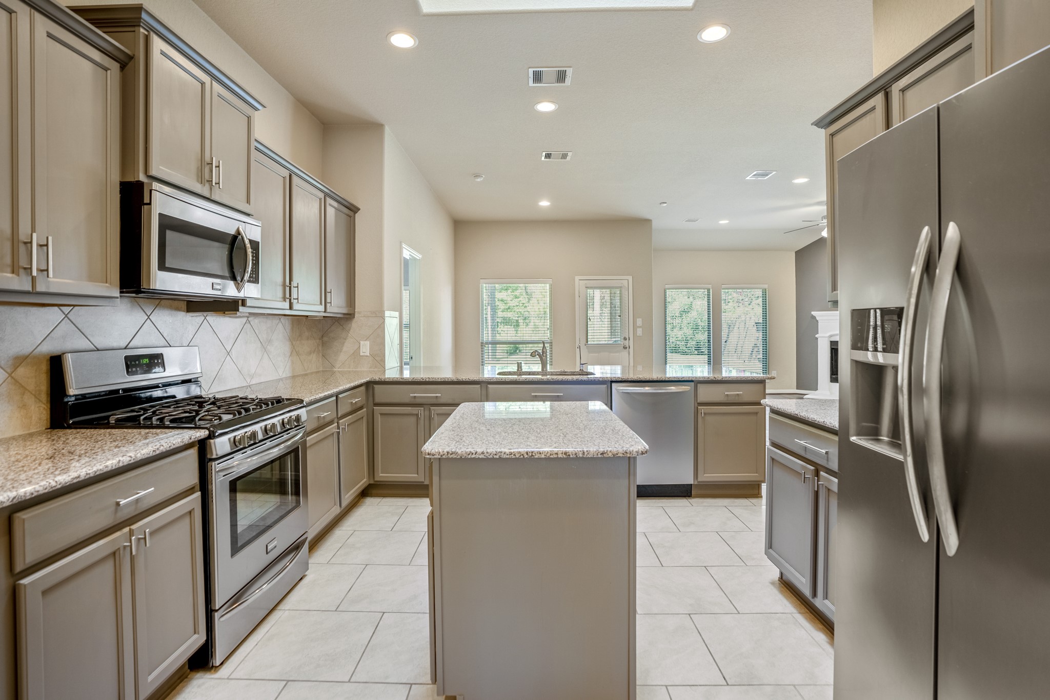 5319 Claymore Meadow Lane Spring, TX 77389 - Photo 13 of 33 The stainless steel appliances offer a modern look to the island kitchen, with an abundance of storage.