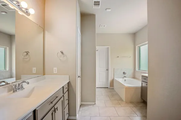 a view of a house with a yard and sitting area