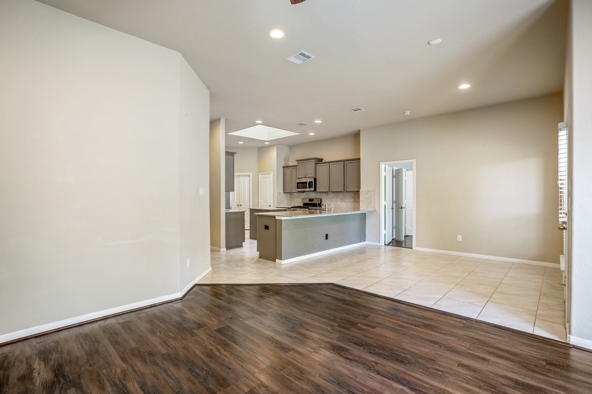 5319 Claymore Meadow Lane Spring, TX 77389 - Photo 32 of 33 The gleaming floors offer clean lines with a modern touch with an open floor plan.