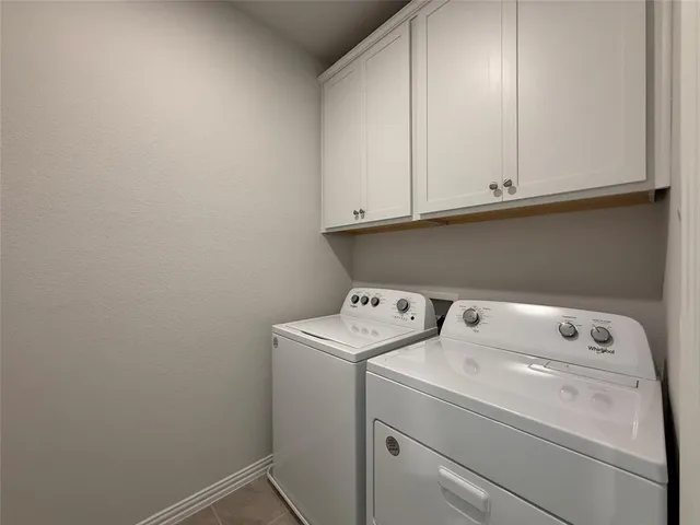 an empty room with an empty space and a ceiling fan