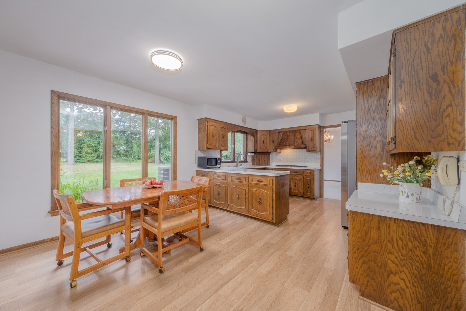 8436 Clynderven Road Burr Ridge, IL 60527 - Photo 11 of 39 a living room with furniture and a large window