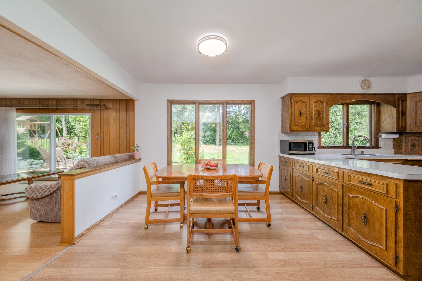 8436 Clynderven Road Burr Ridge, IL 60527 - Photo 12 of 39 a large kitchen with a table and chairs
