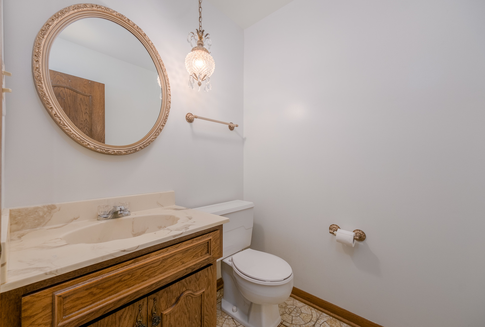 8436 Clynderven Road Burr Ridge, IL 60527 - Photo 17 of 39 a bathroom with a sink and a mirror