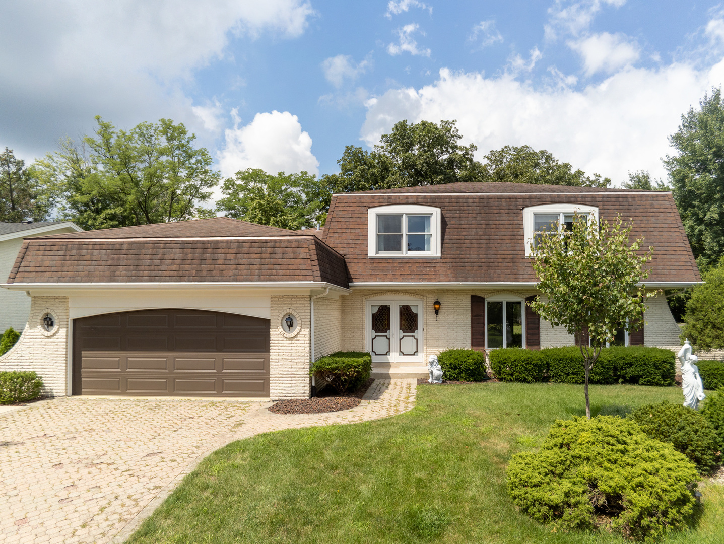 8436 Clynderven Road Burr Ridge, IL 60527 - Photo 2 of 39 a front view of a house with a yard and garage
