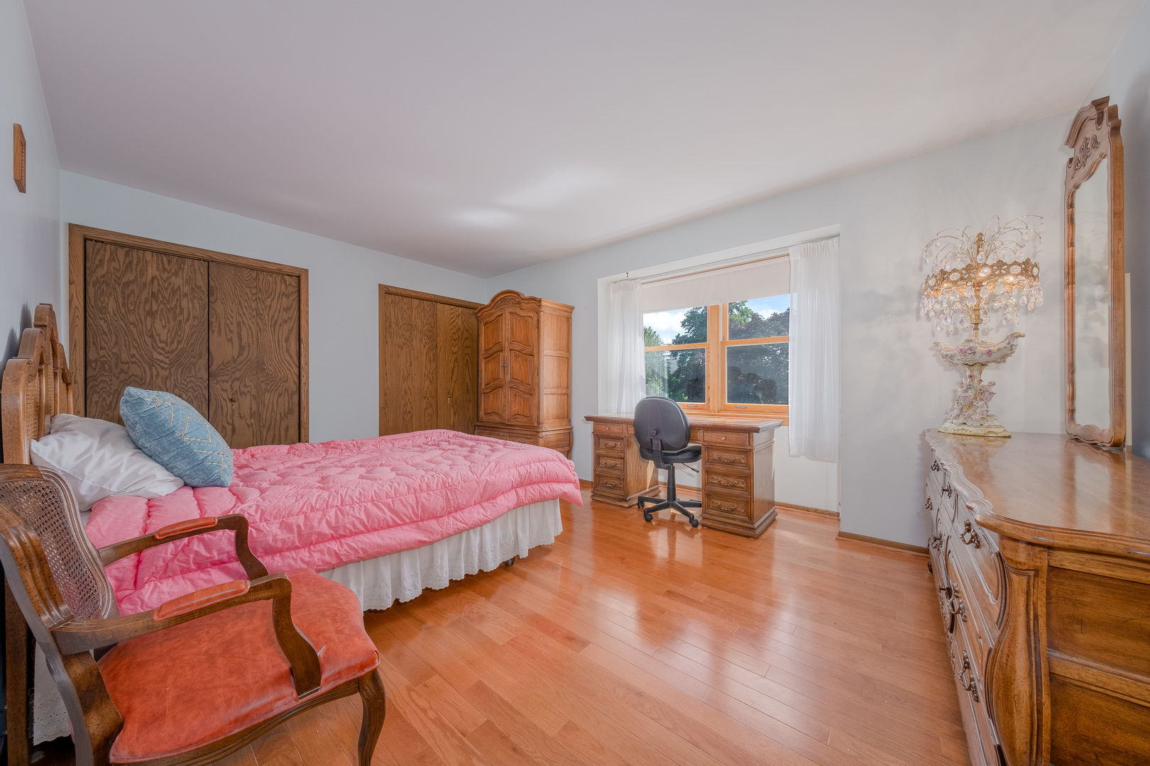 8436 Clynderven Road Burr Ridge, IL 60527 - Photo 21 of 39 a bedroom with furniture and a window