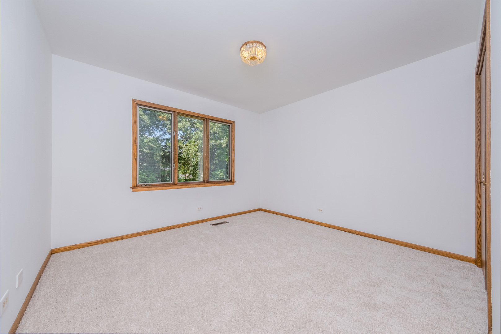 8436 Clynderven Road Burr Ridge, IL 60527 - Photo 23 of 39 a view of an empty room with a window