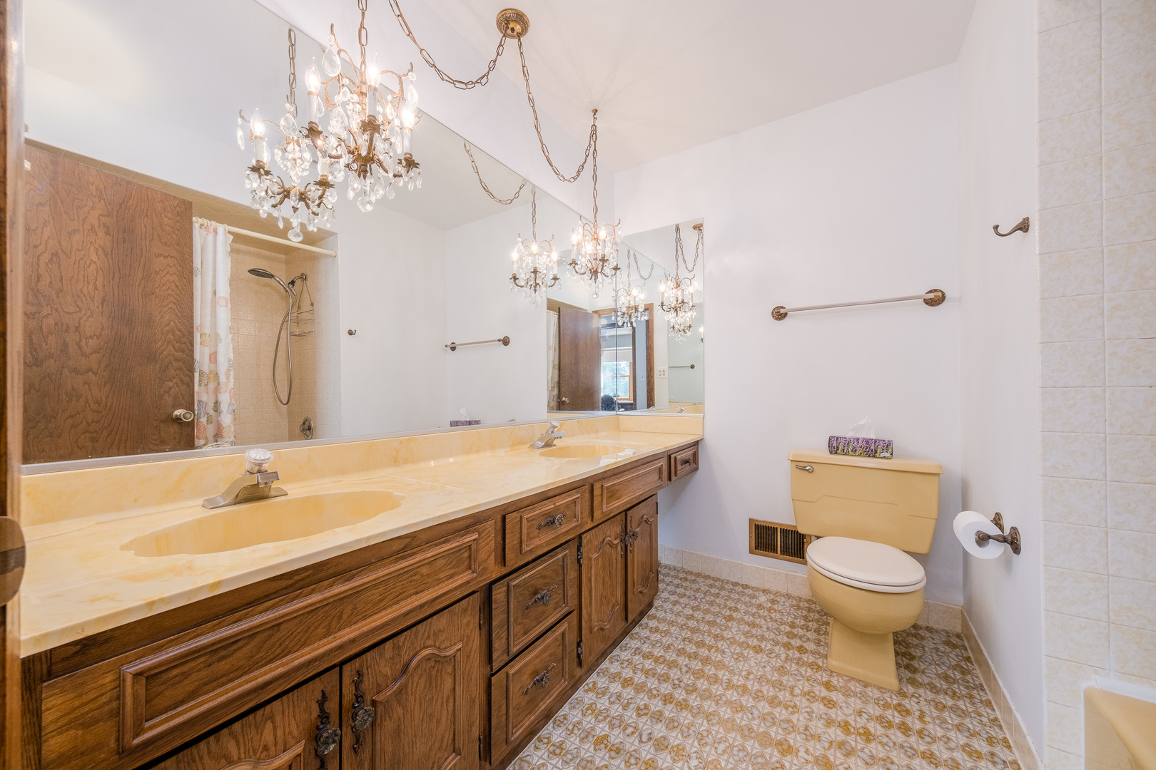 8436 Clynderven Road Burr Ridge, IL 60527 - Photo 24 of 39 a spacious bathroom with a granite countertop sink a toilet and a mirror