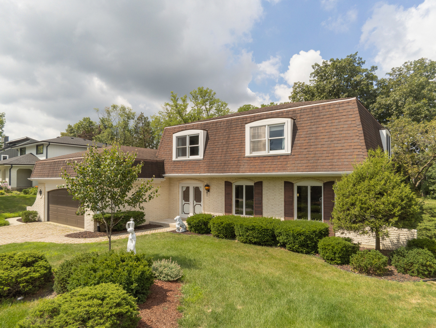 8436 Clynderven Road Burr Ridge, IL 60527 - Photo 3 of 39 a front view of a house with a yard