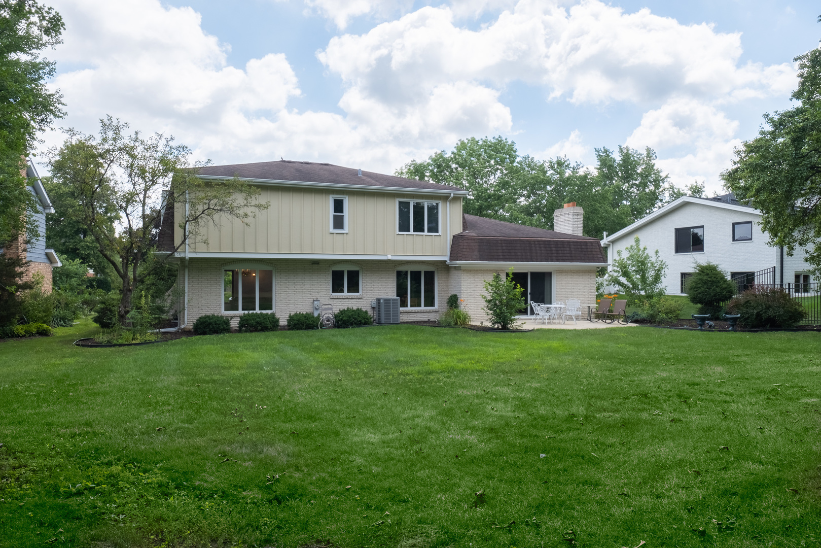8436 Clynderven Road Burr Ridge, IL 60527 - Photo 33 of 39 a view of a house with a big yard potted plants and a large tree