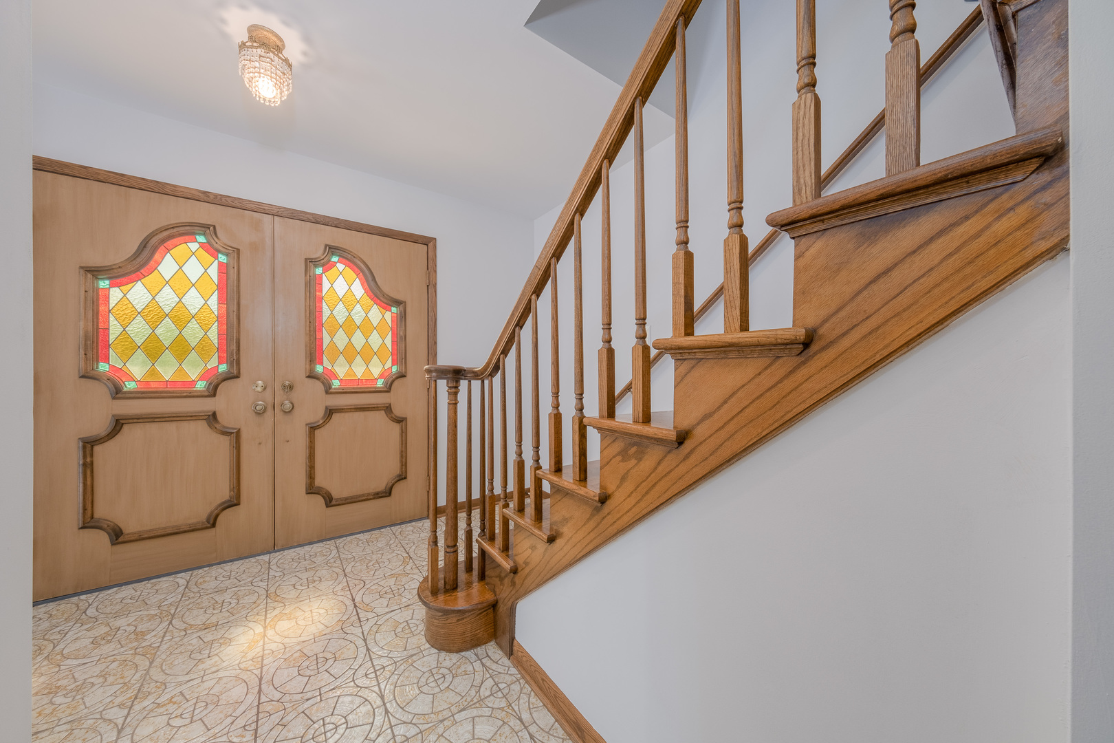 8436 Clynderven Road Burr Ridge, IL 60527 - Photo 5 of 39 a view of entryway with wooden floor and windows